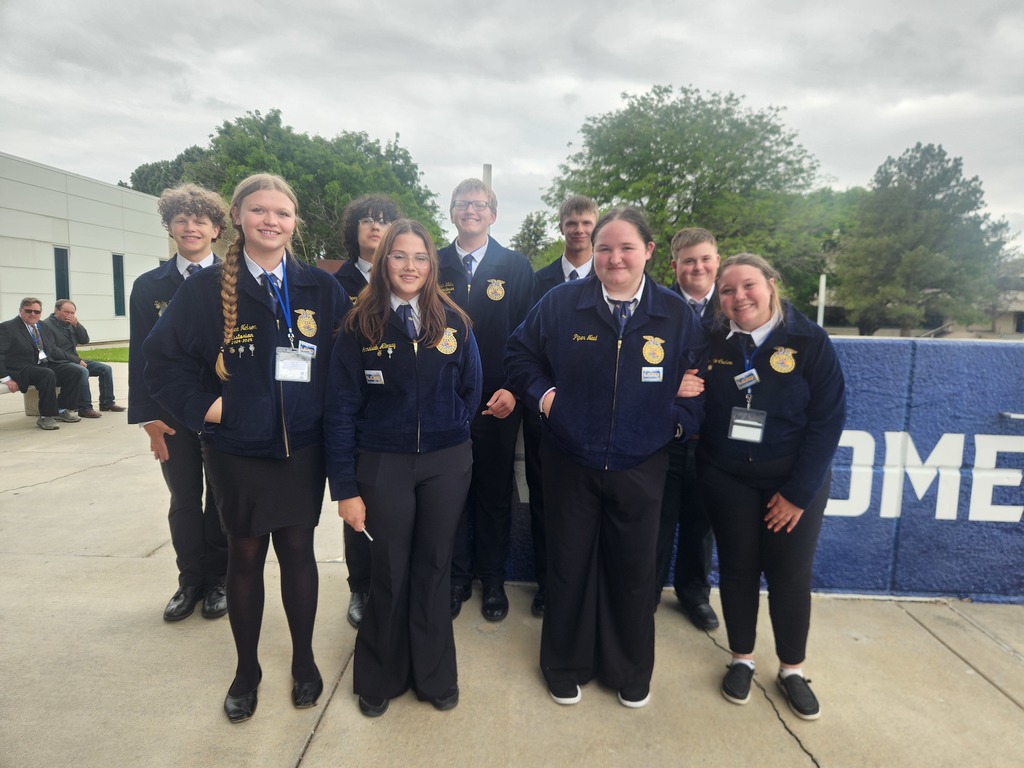 Nine FFA members standing together at State FFA Convention.