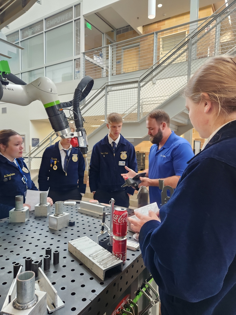 WV FFA members talking to administration career representatives during the career fair at the convention.