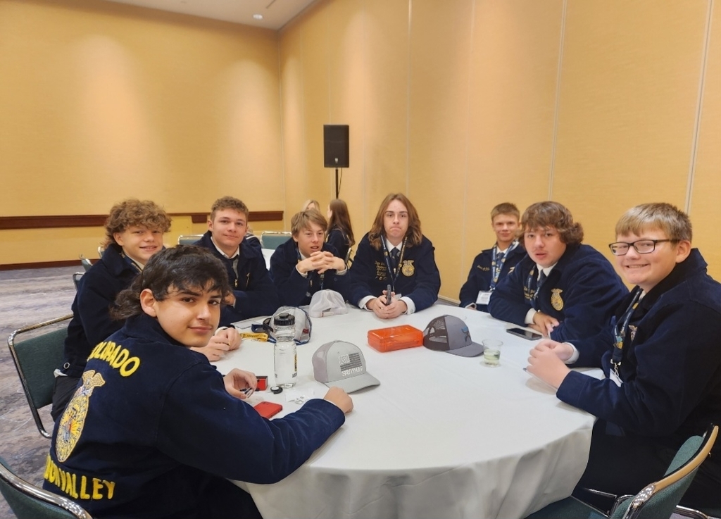 FFA members sitting at a table for a leadership workshop