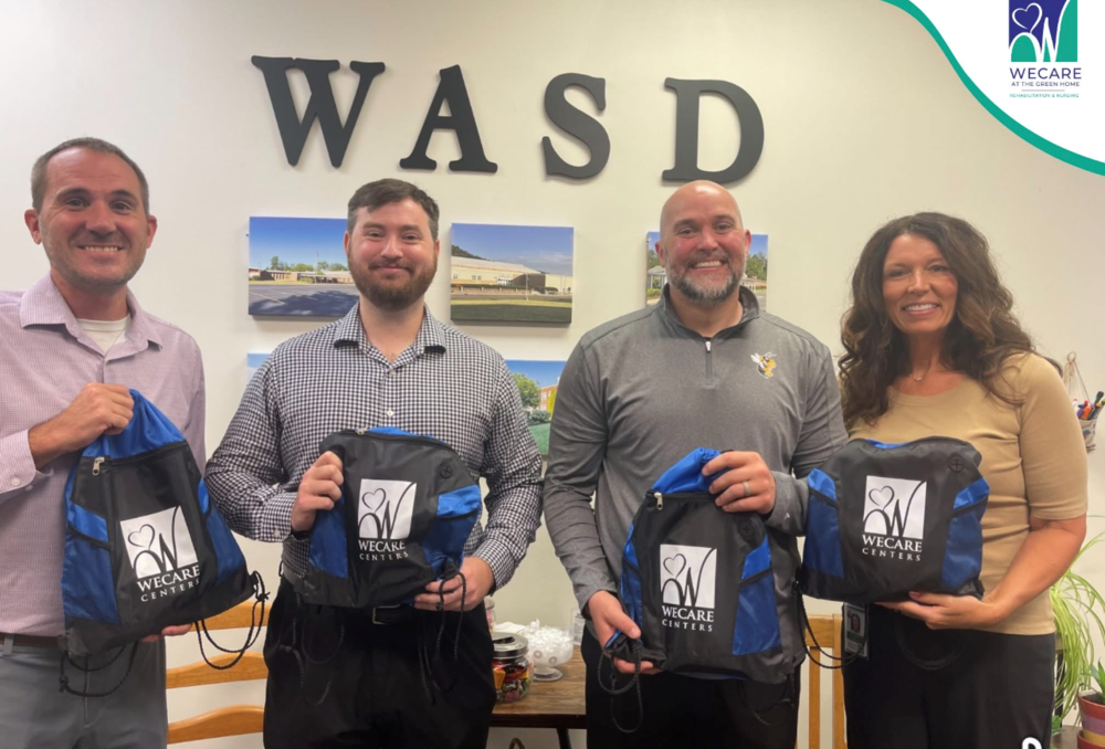 Representatives from We Care and the WASD Administration