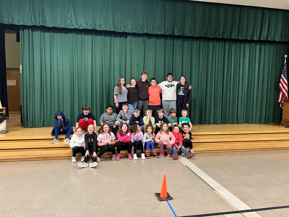 Students at Don Gill Elementary learn from the HS Bocce team.