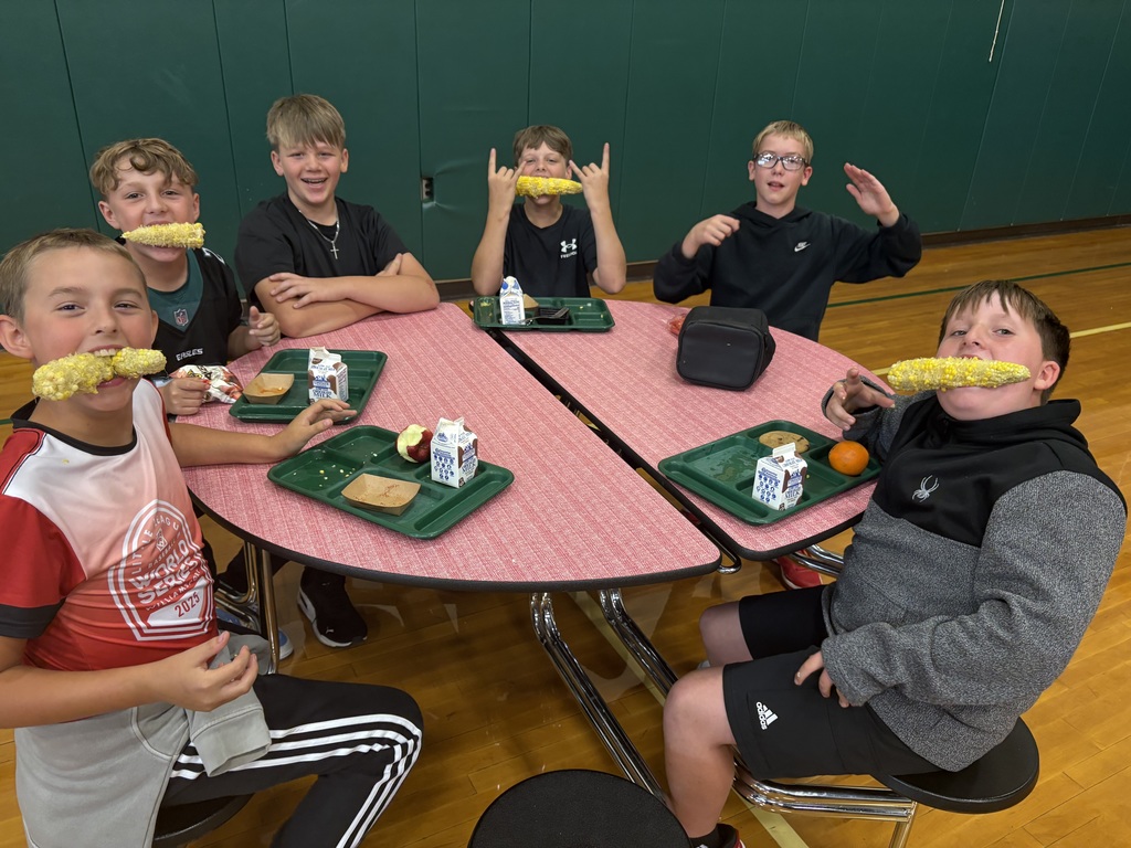 Students eating Corn