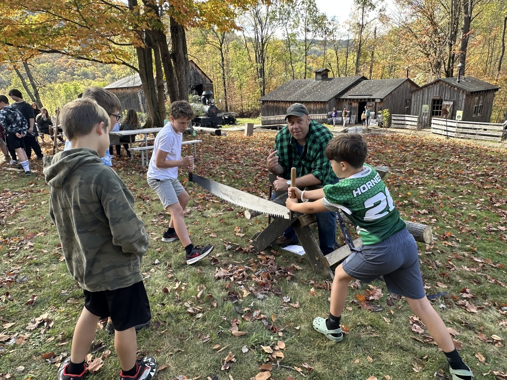 Students using cross saw