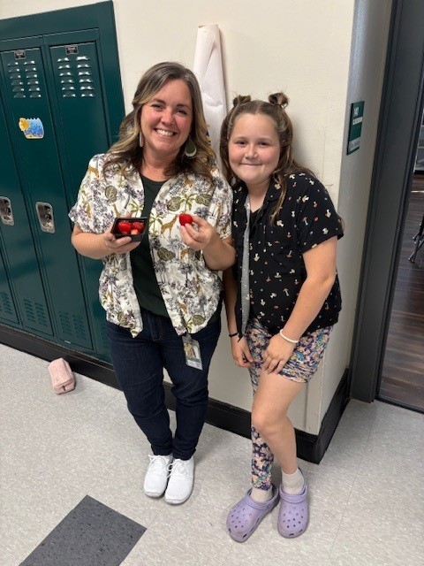 student and teacher in hallway