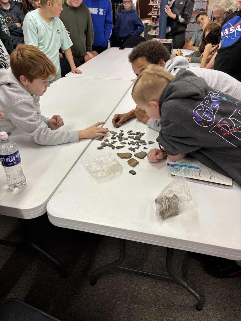Students looking at rocks
