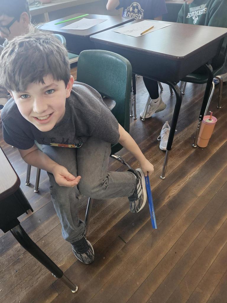 student measuring foot