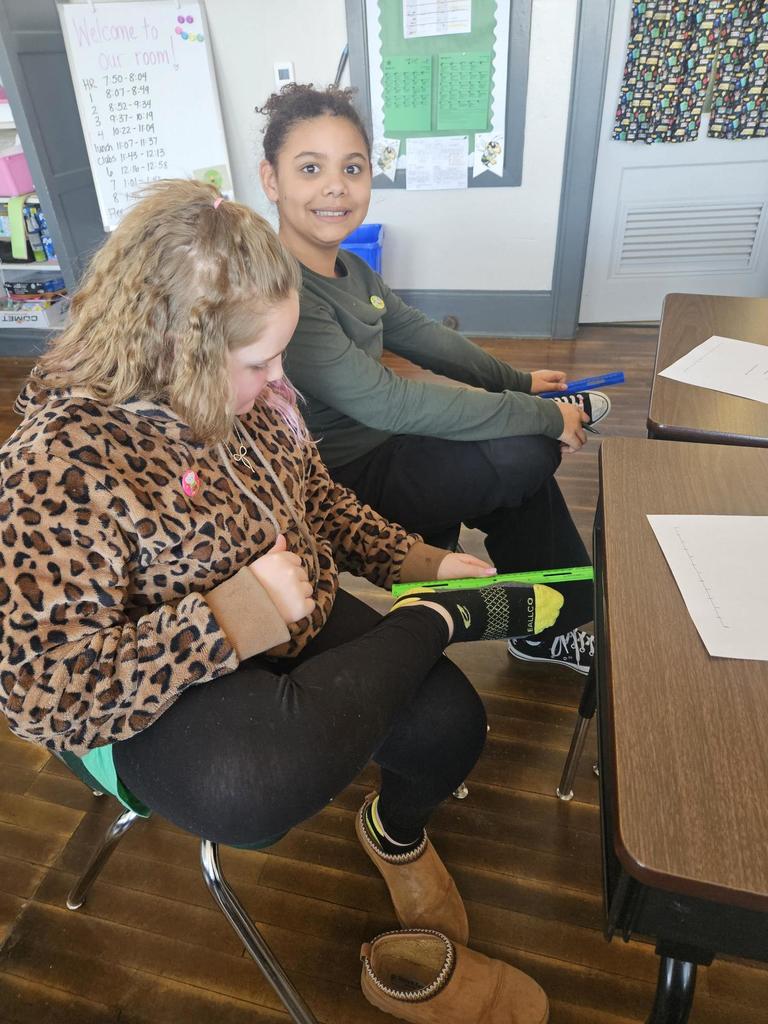 student measuring foot