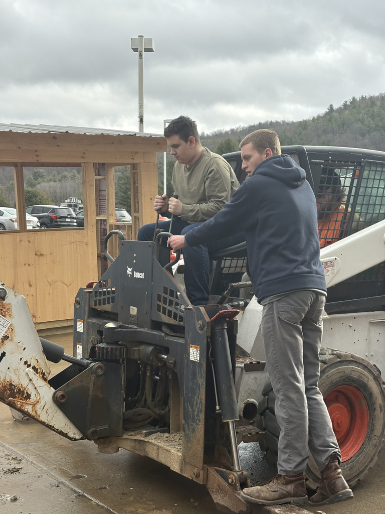 Student on skid steer