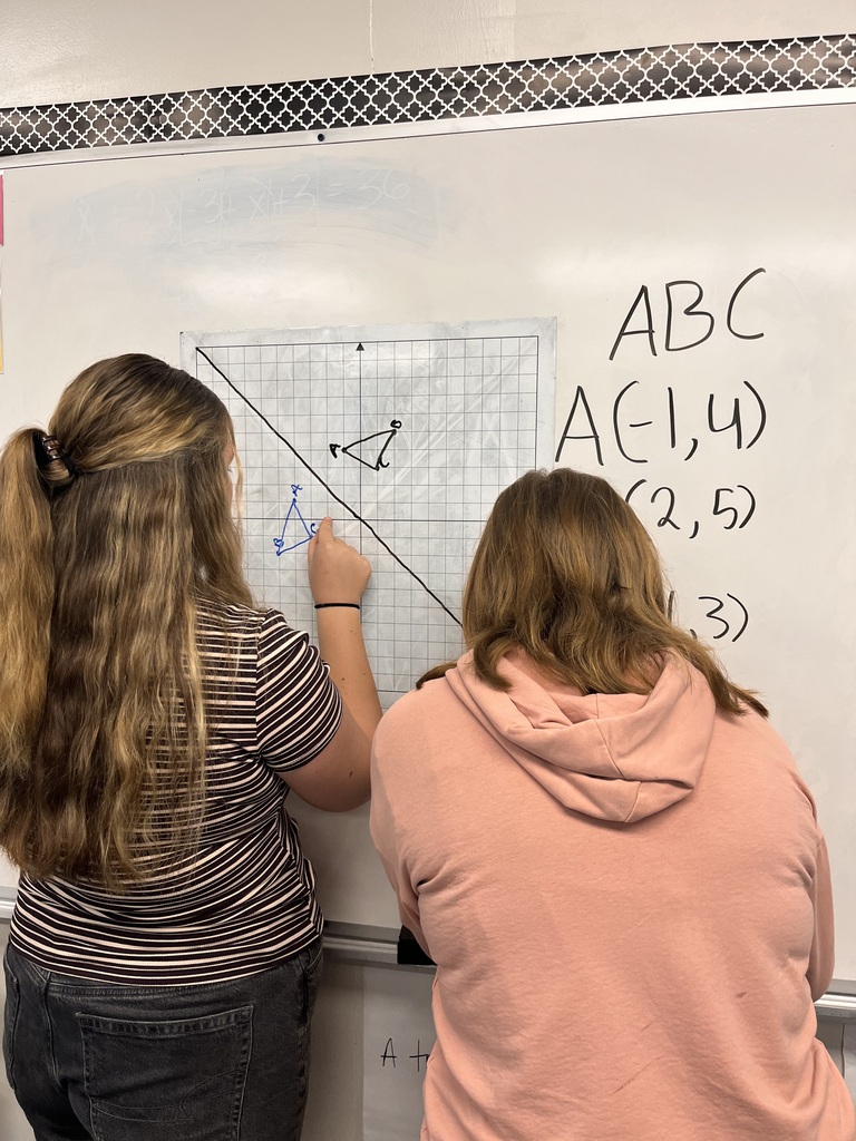 Students at white board