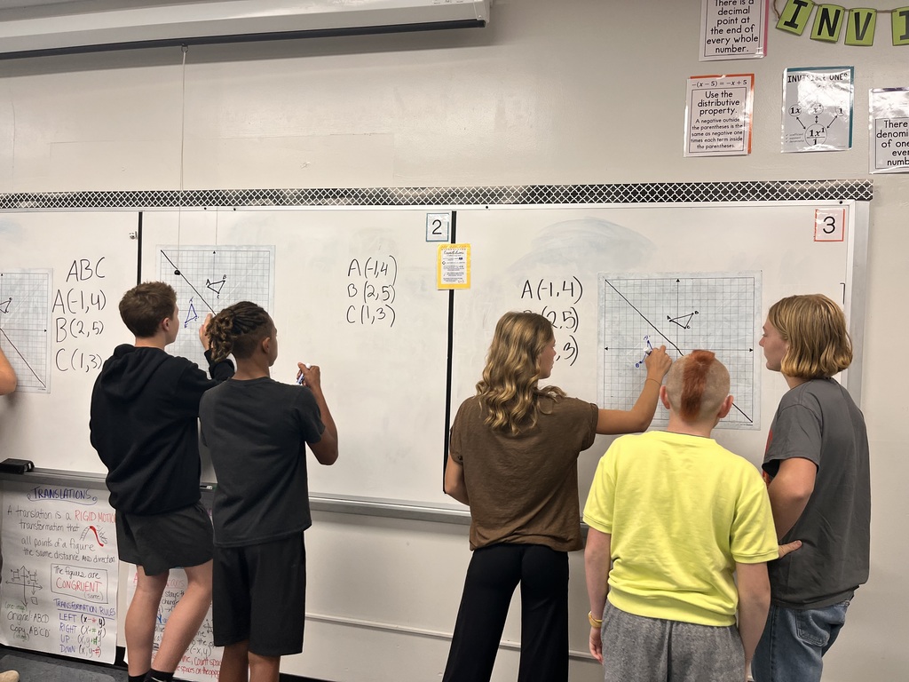 Students at white board
