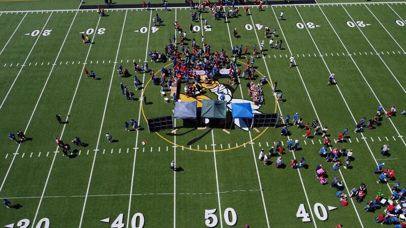 Center field at WASD with drone picture.