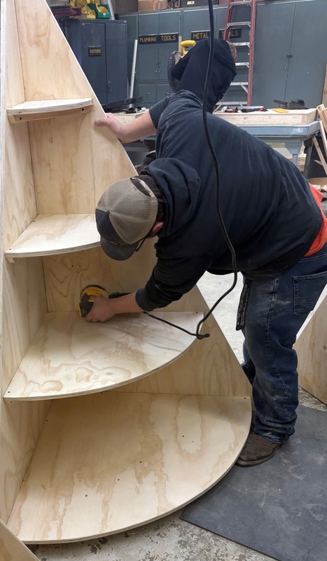 Construction student sanding