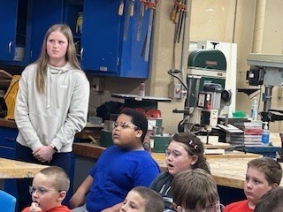 Student listen to information about bats.