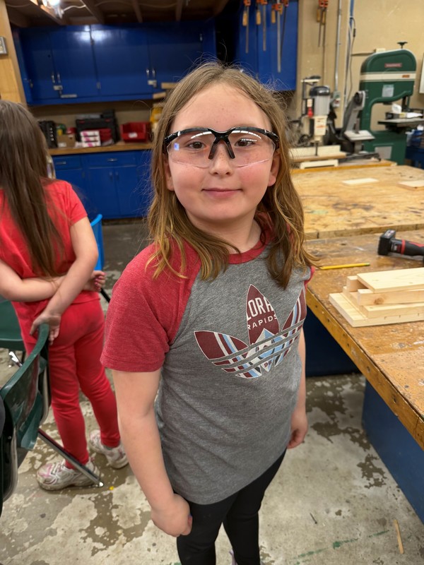 Student with safety glasses in the shop.