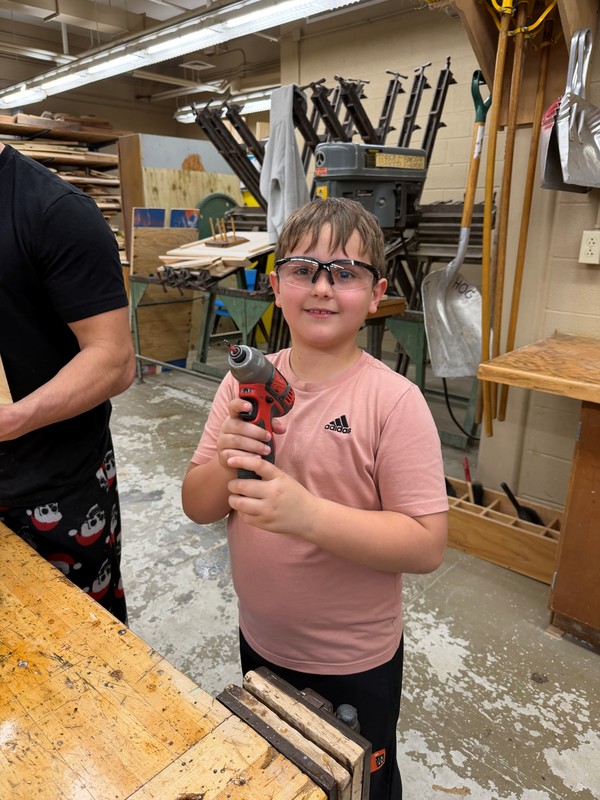 Student with safety glasses in the Ag. Mech. Shop.
