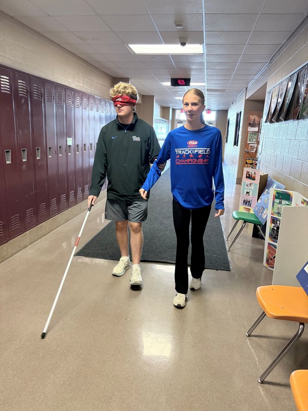 Disability awareness training with students walking blinded