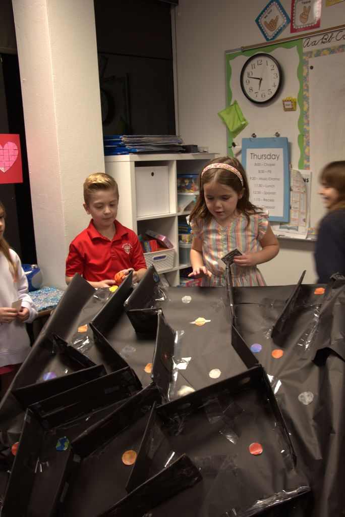 Students enjoying third grade's simple machine games.