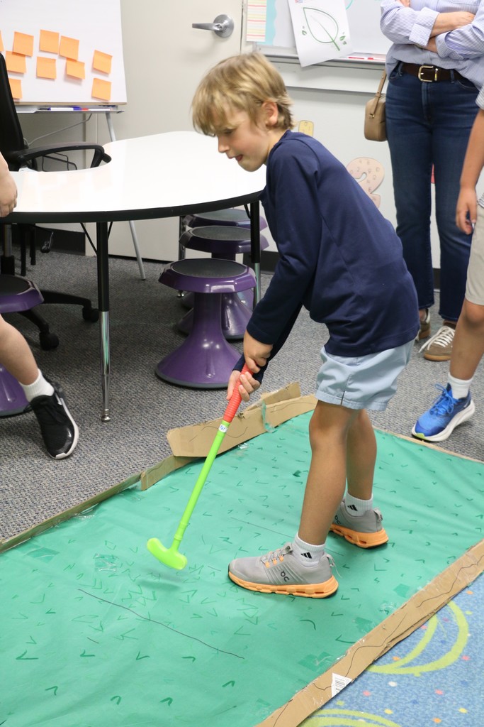 Student enjoying third grade's simple machine games.