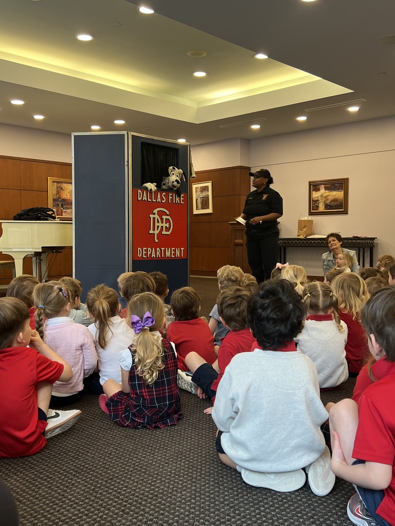 Students learn about fire safety from a special guest.