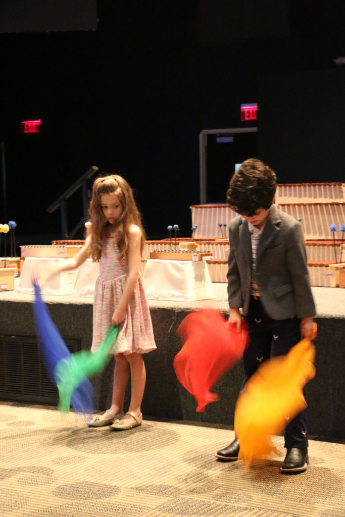 Primer students perform with scarves.