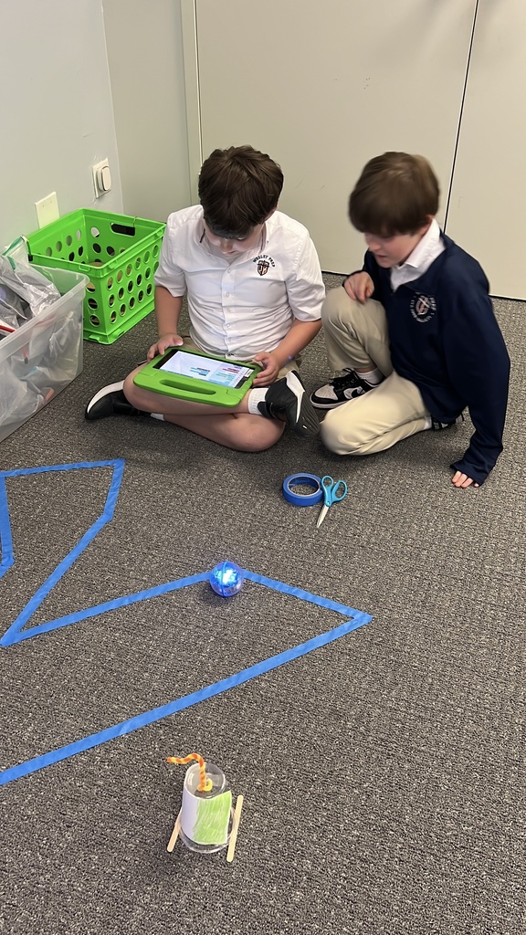 Students working on coding for their Sphero robot.