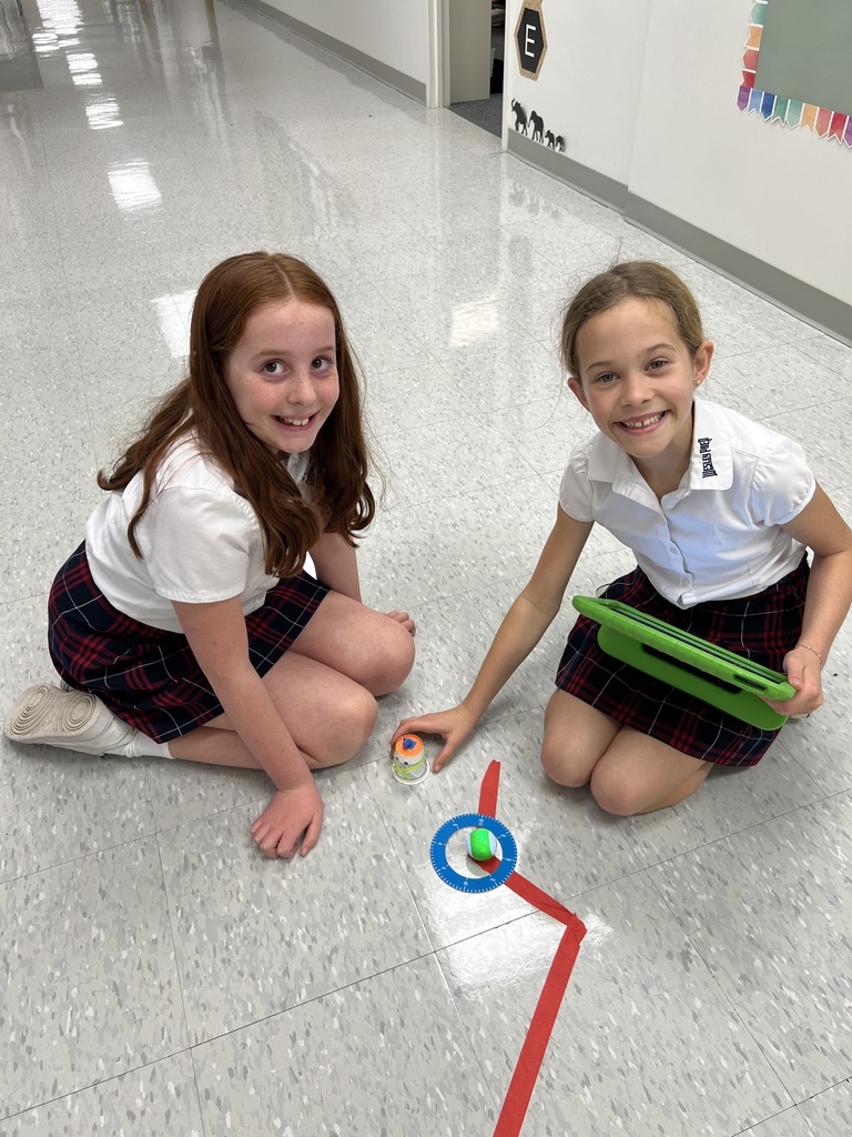 Students pose with their projects.