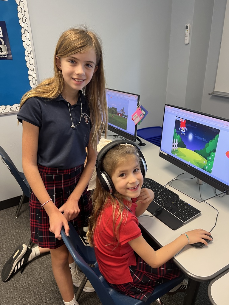 Fifth graders getting feedback on the games they coded.