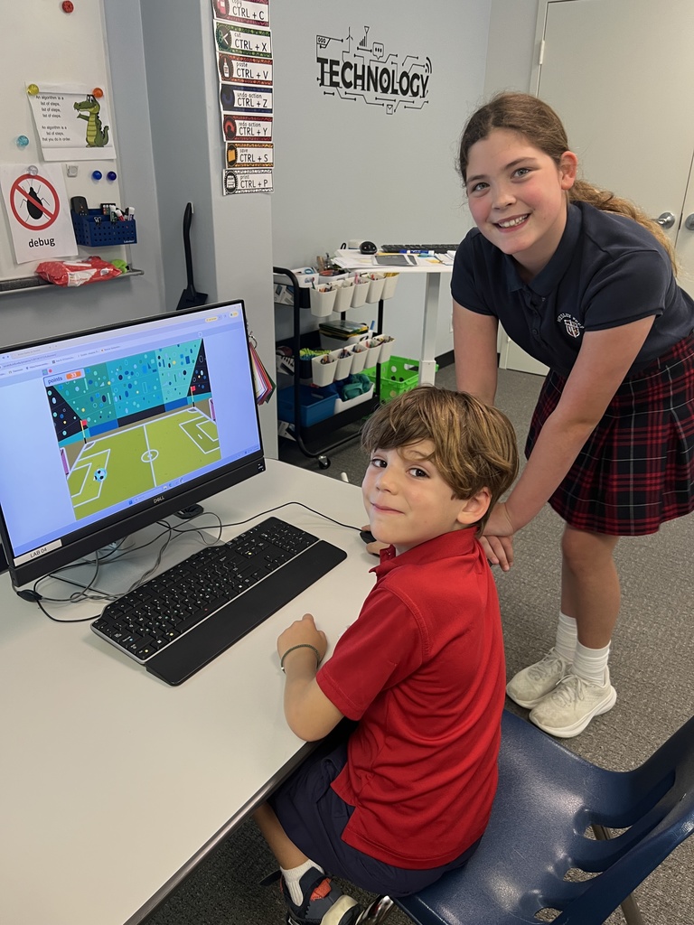 Fifth graders getting feedback on the games they coded.