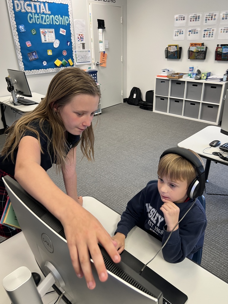 Fifth graders getting feedback on the games they coded.