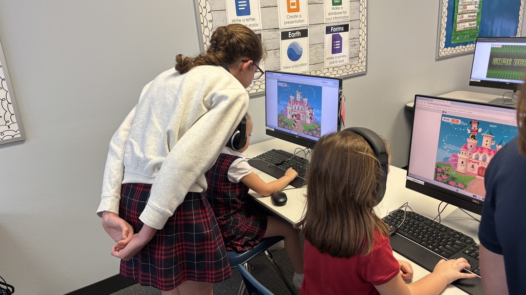 Fifth graders getting feedback on the games they coded.