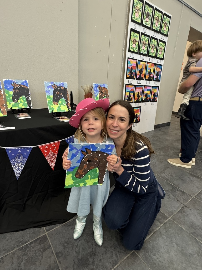 Early childhood student showing her horse artwork.