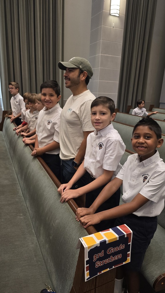 Smiling just before Chapel starts.