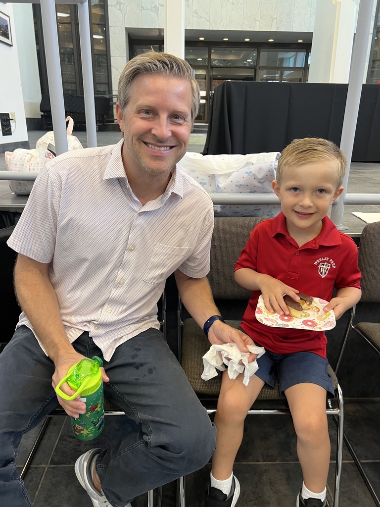 Enjoying donuts with dad.