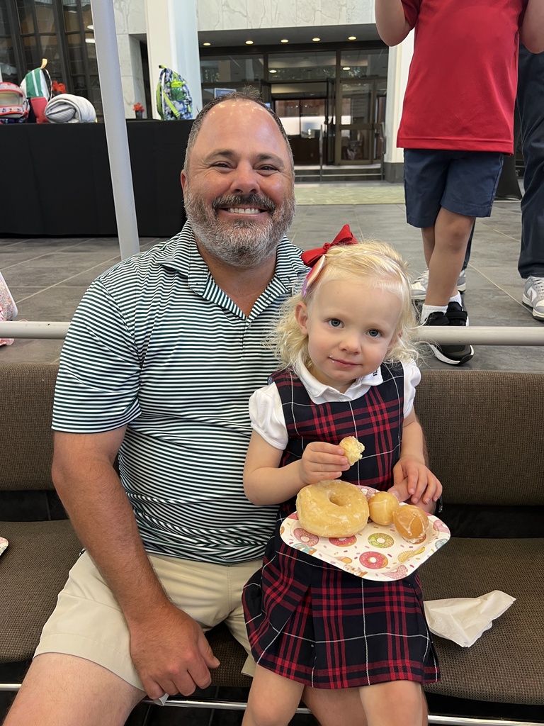 Enjoying donuts with dad.