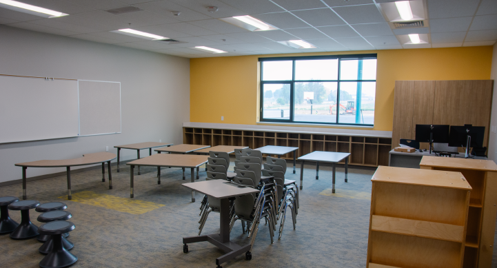 Independence Elementary classroom being filled in with desks and chairs.