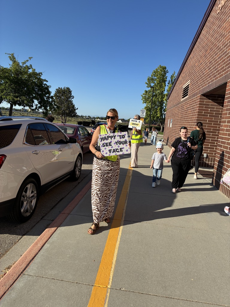 woman holding sign that says happy to see your face