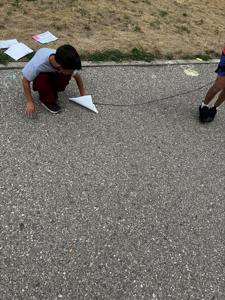 students measruing on blacktop