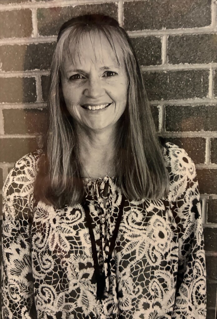 A black and white photo of Gina Nelson