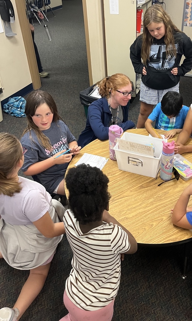 1st and 4th grade buddies working on a project together