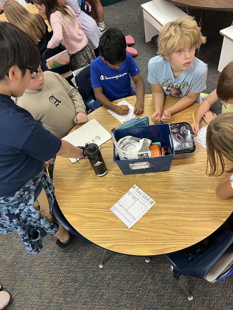 1st and 4th grade buddies working on a project together