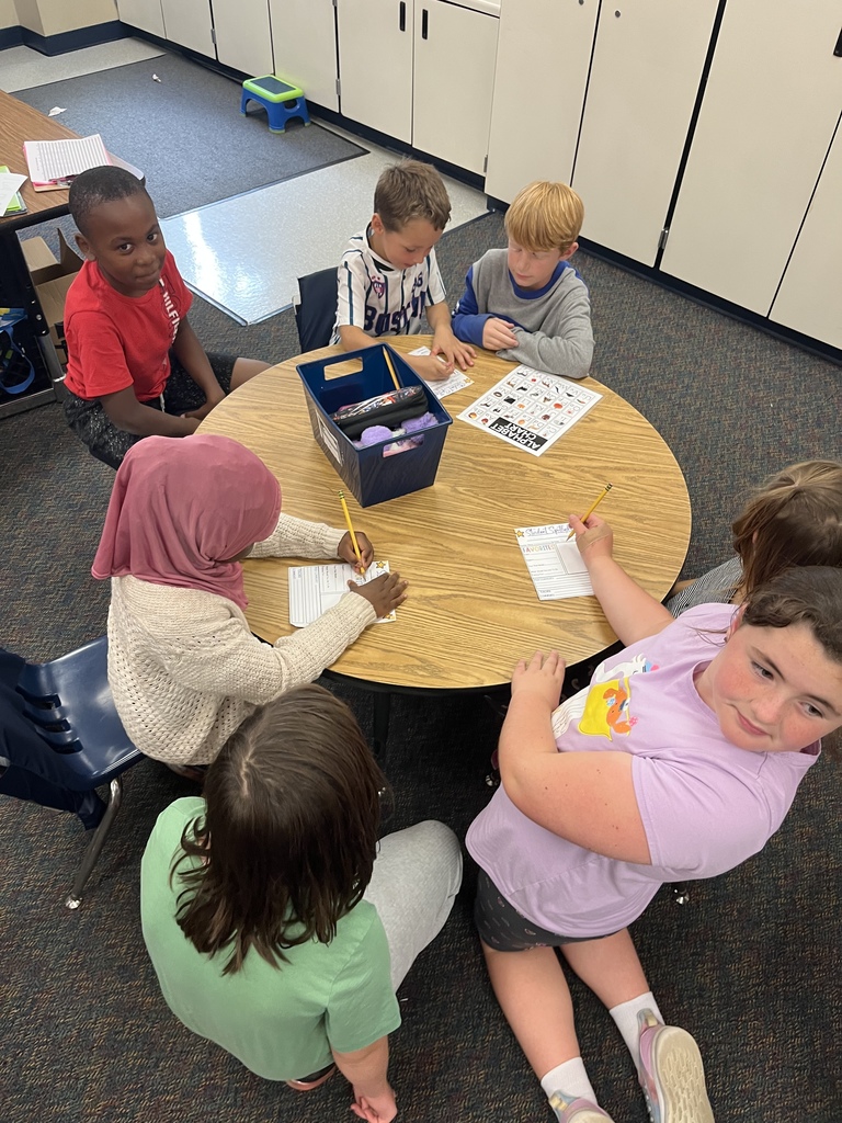1st and 4th grade buddies working on a project together