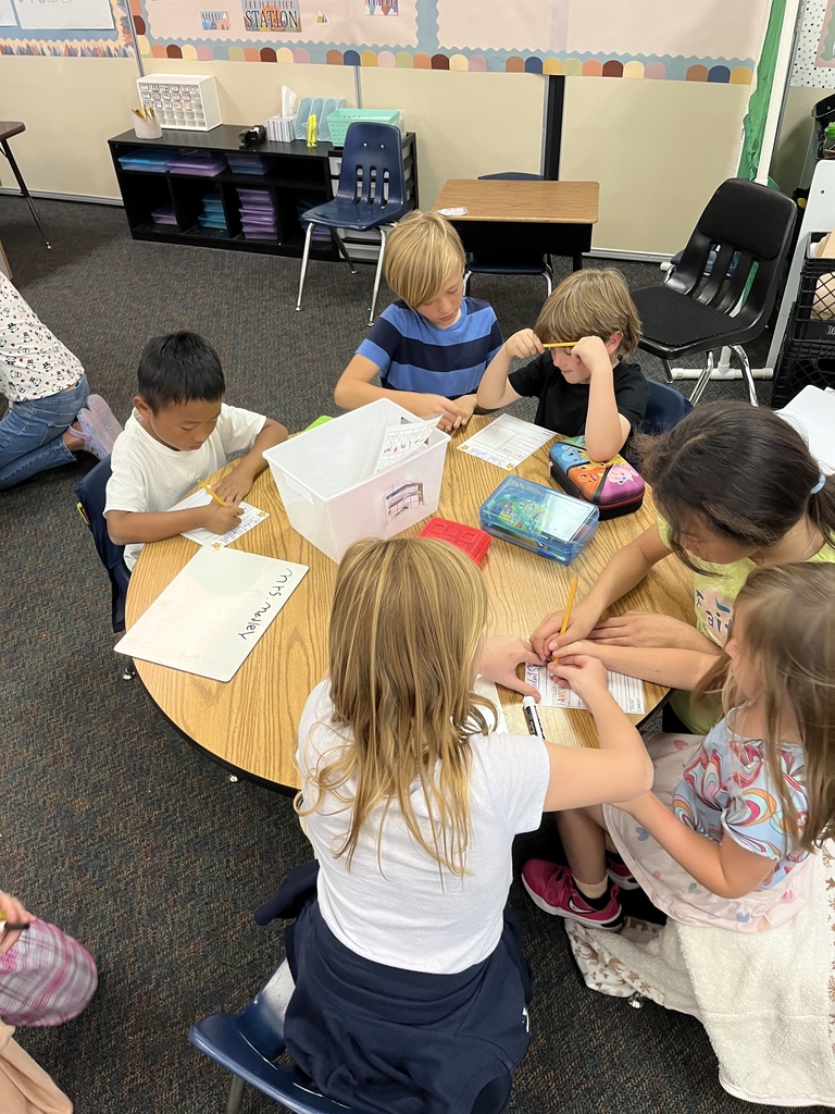 1st and 4th grade buddies working on a project together