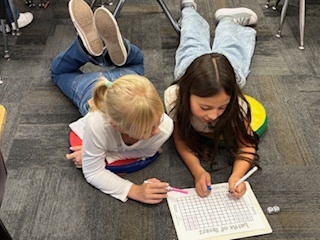 Students working on the floor