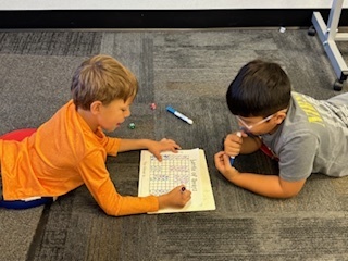 Students working on the floor