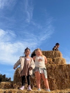 kids on hay bales