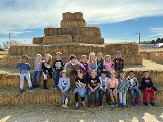 kids on hay bales