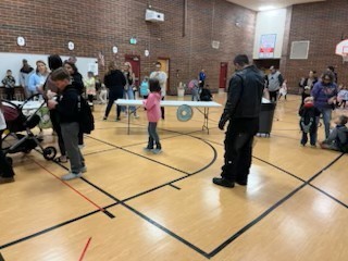 people in gym eating donuts