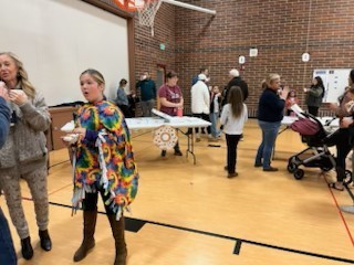 people in gym eating donuts