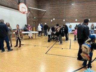 people in gym eating donuts