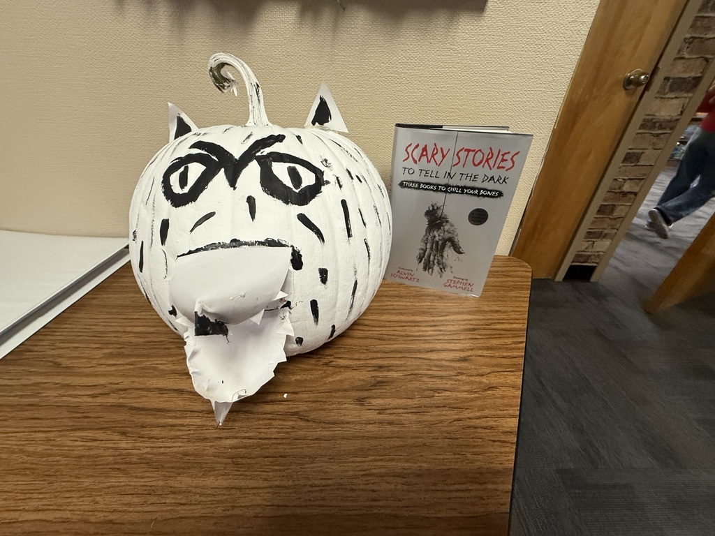 An image showing a pumpkin decorated for Scary Stories to Tell in the Dark